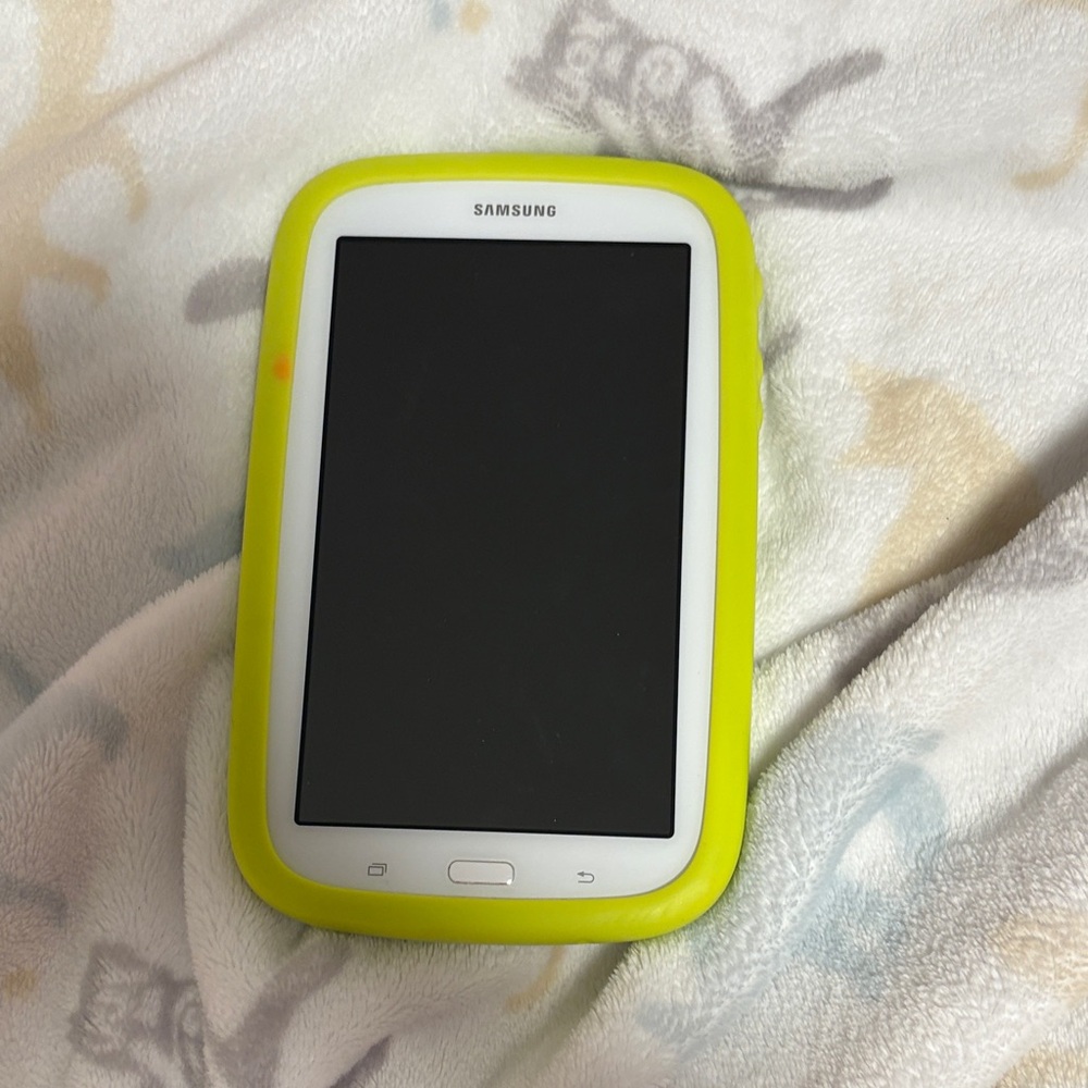 Samsung kids Tablet with Neon Yellow Case and a pair of head phones
